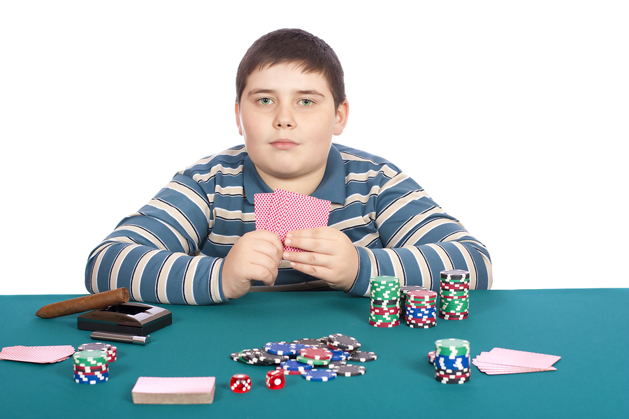 bigstock-Boy-Playing-Poker-15766037